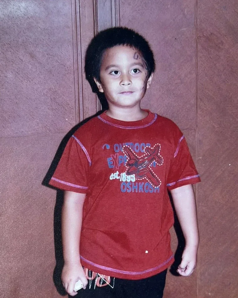 Cole as a child: red t-shirt